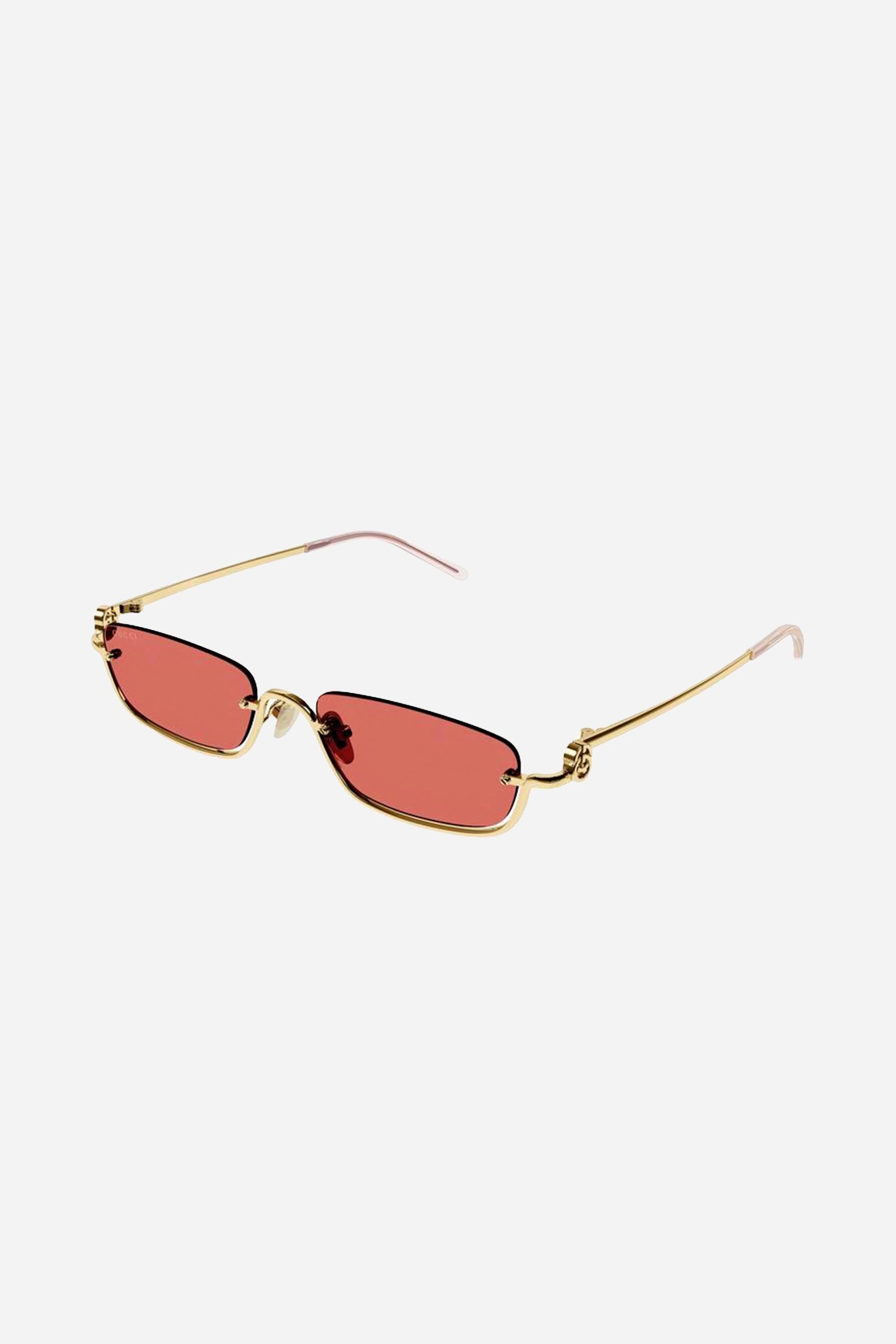 Gucci micro metal sunglasses featuring red lenses