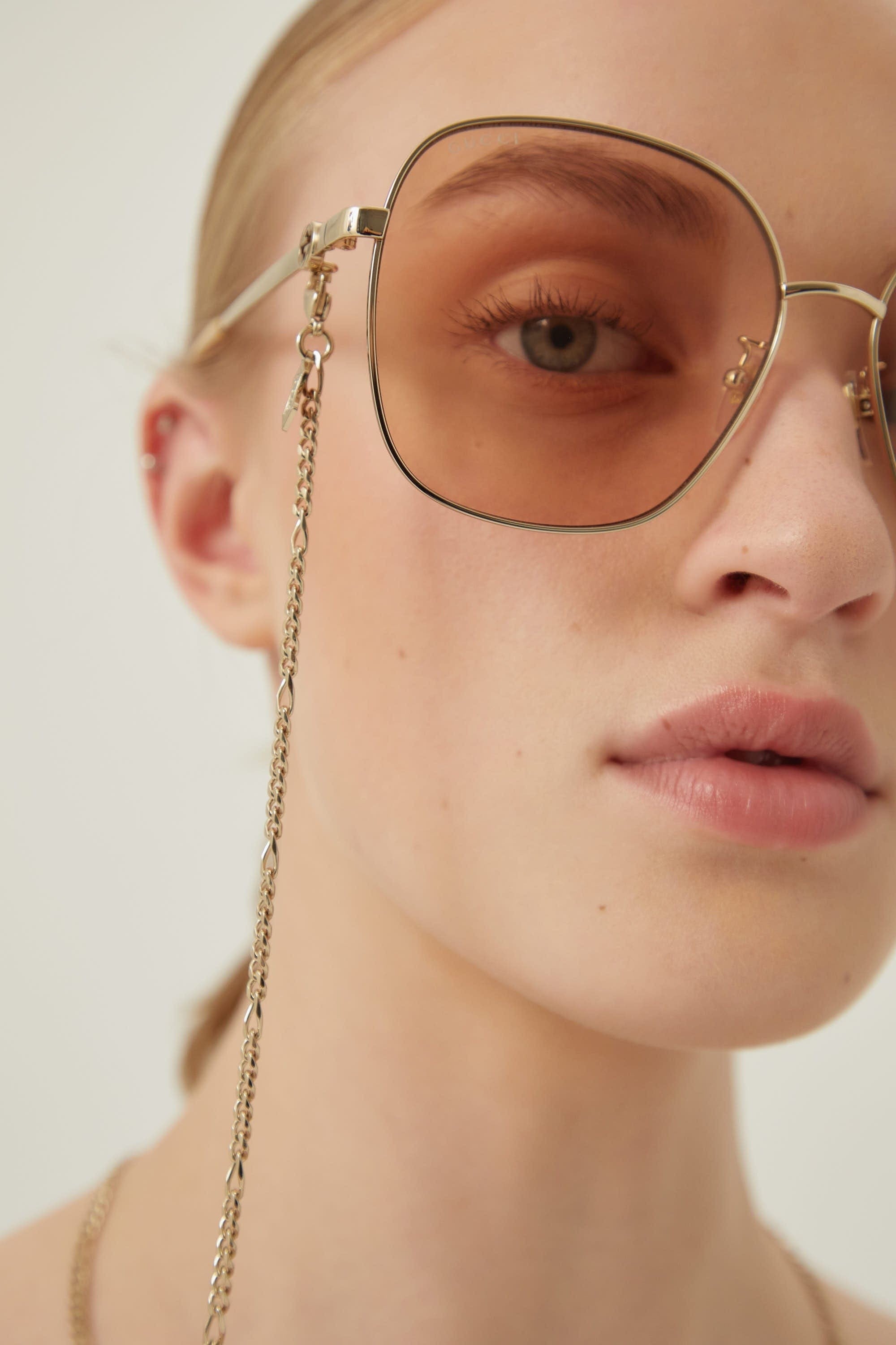 Gucci round metal sunglasses with chain