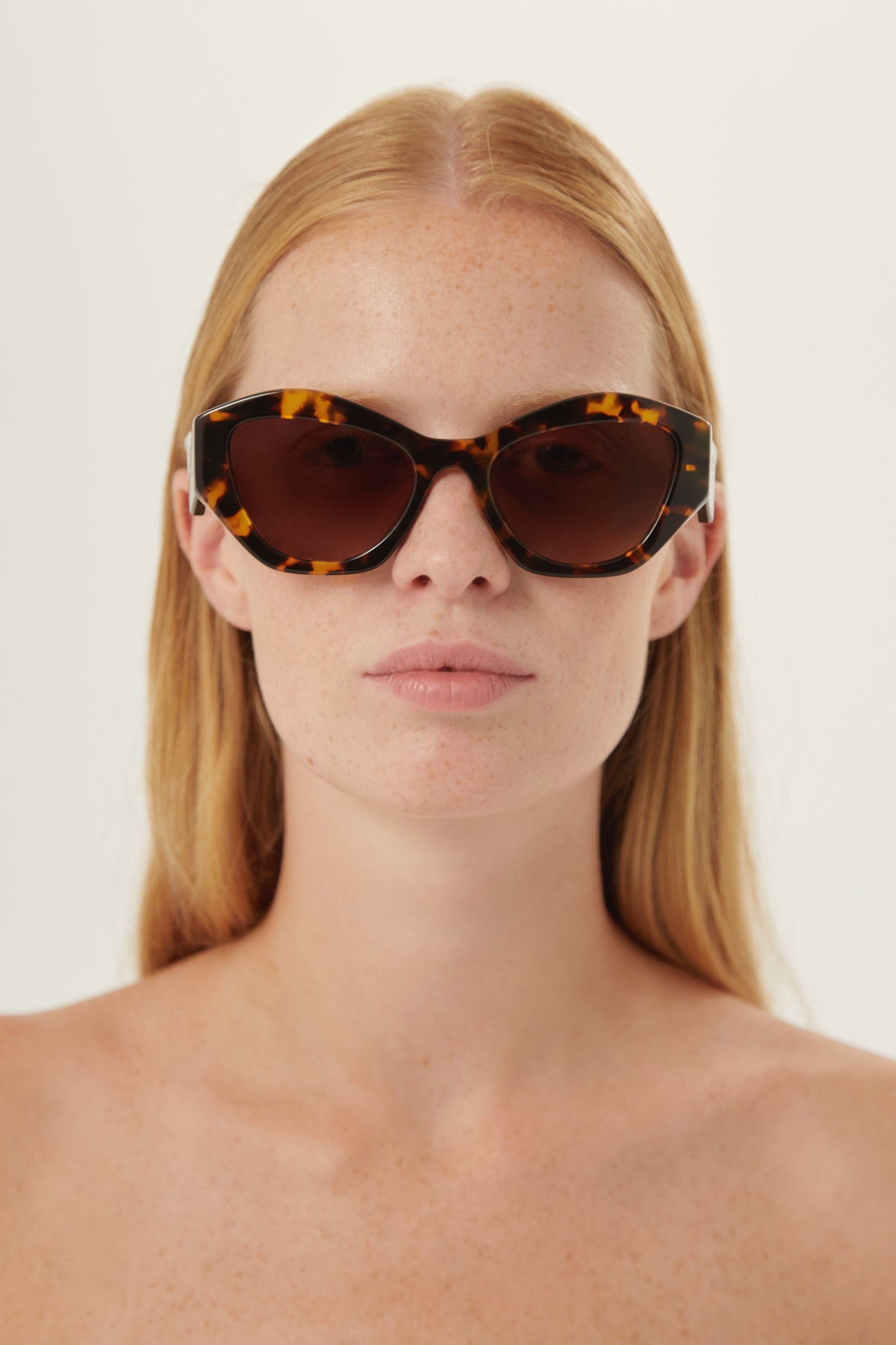 Prada oval sunglasses featuring iconic logo