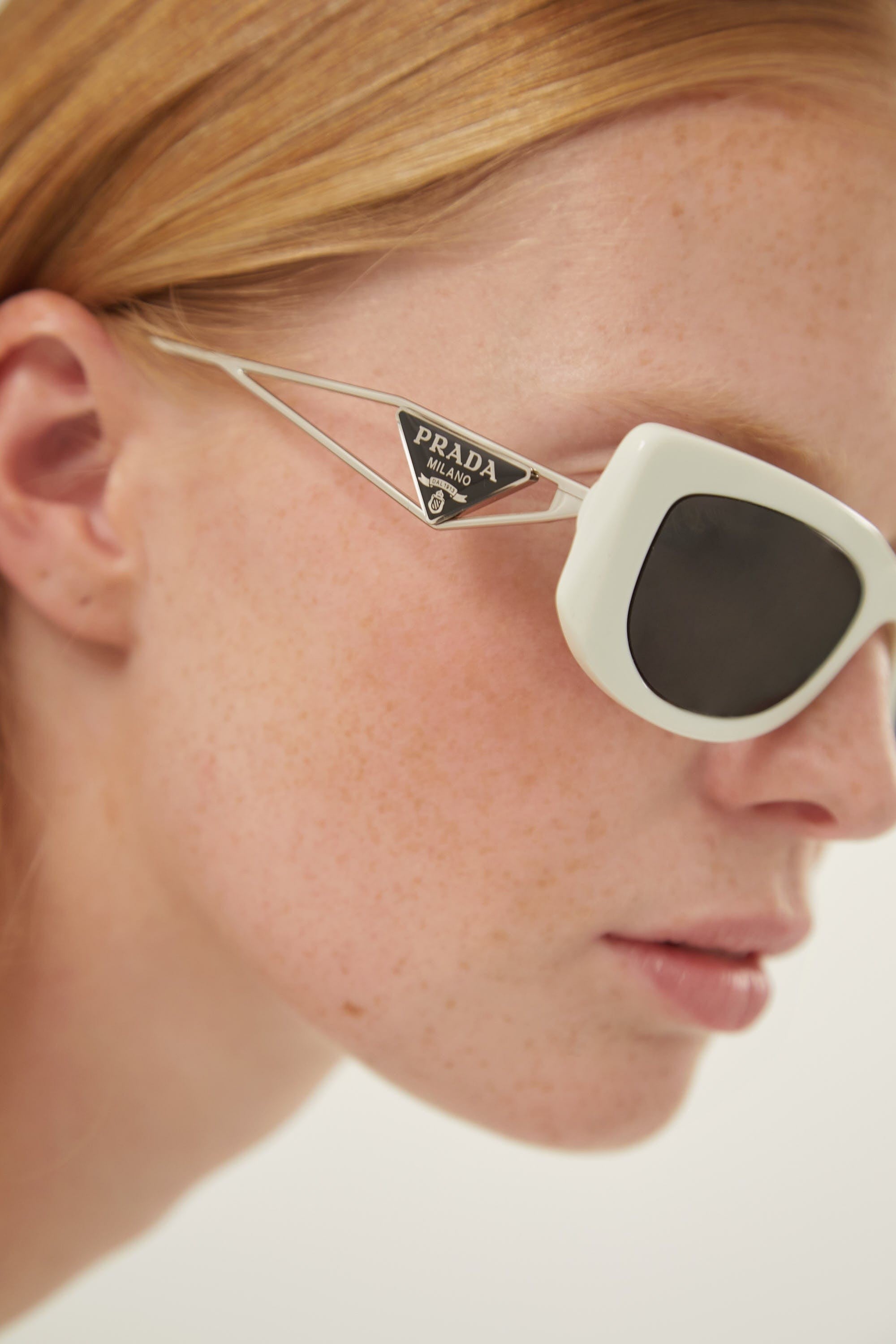 Prada white micro sunglasses with metal temple