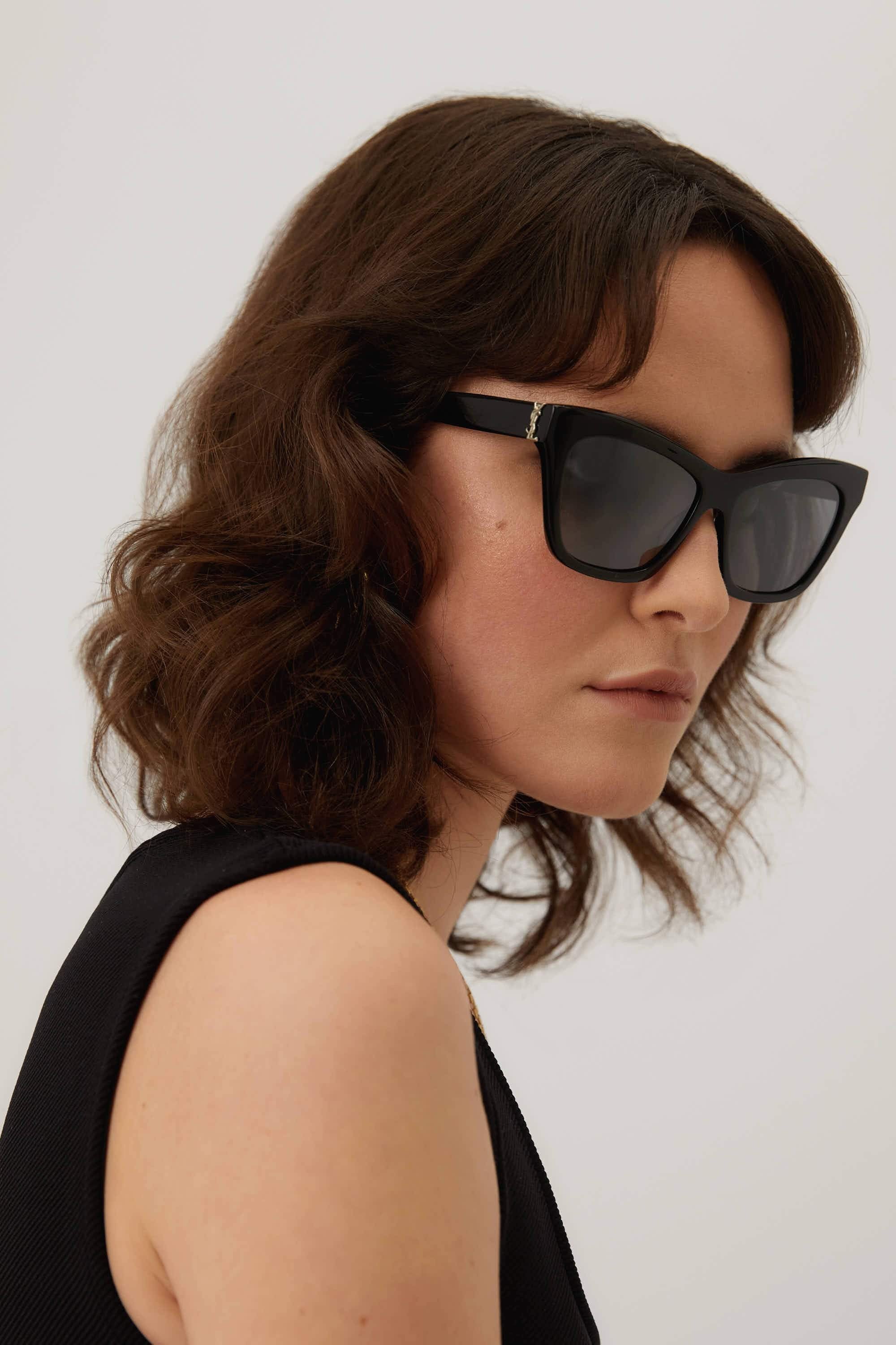 Saint Laurent cat-eye black sunglasses featuring YSL logo