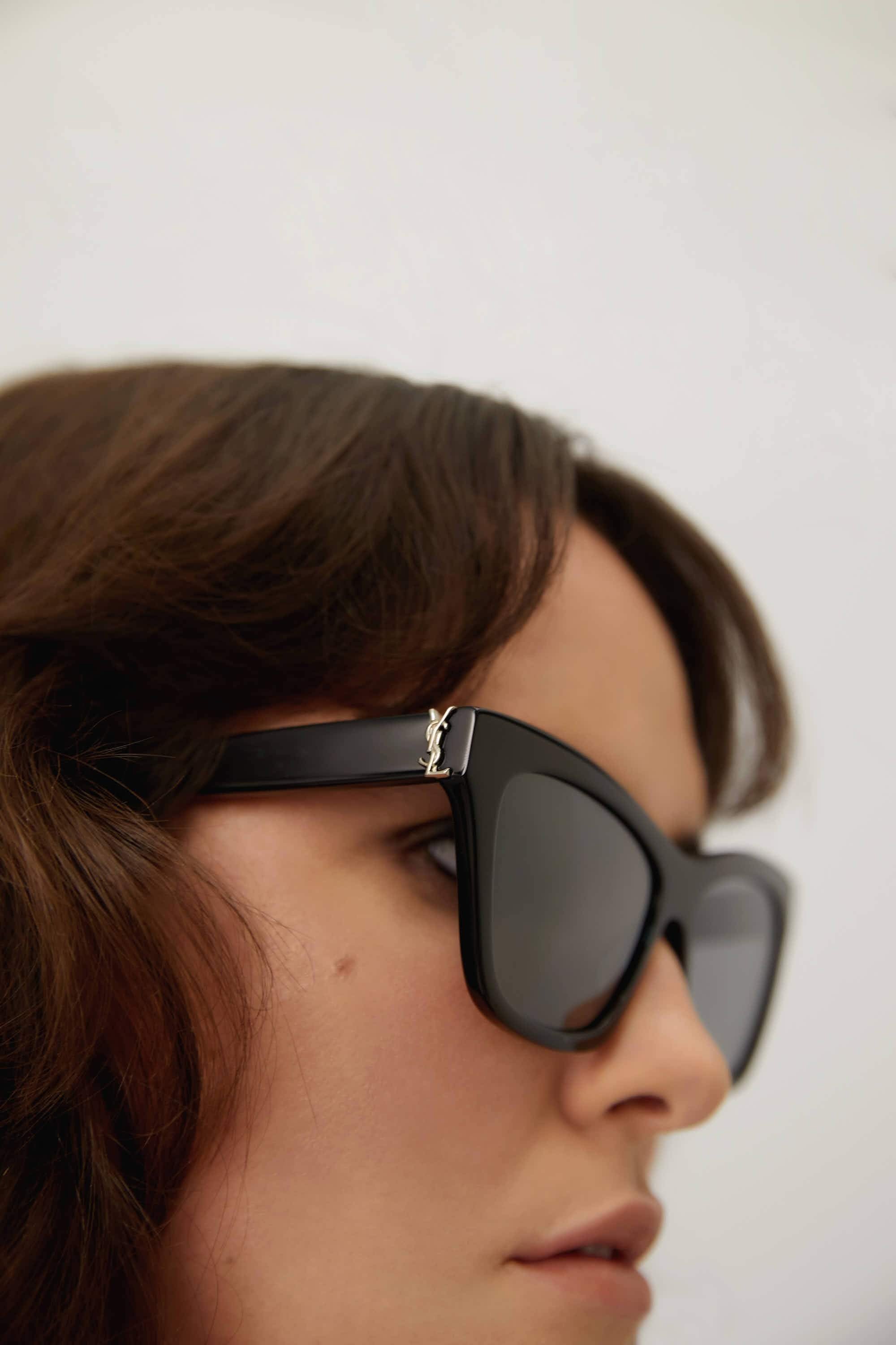 Saint Laurent cat-eye black sunglasses featuring YSL logo