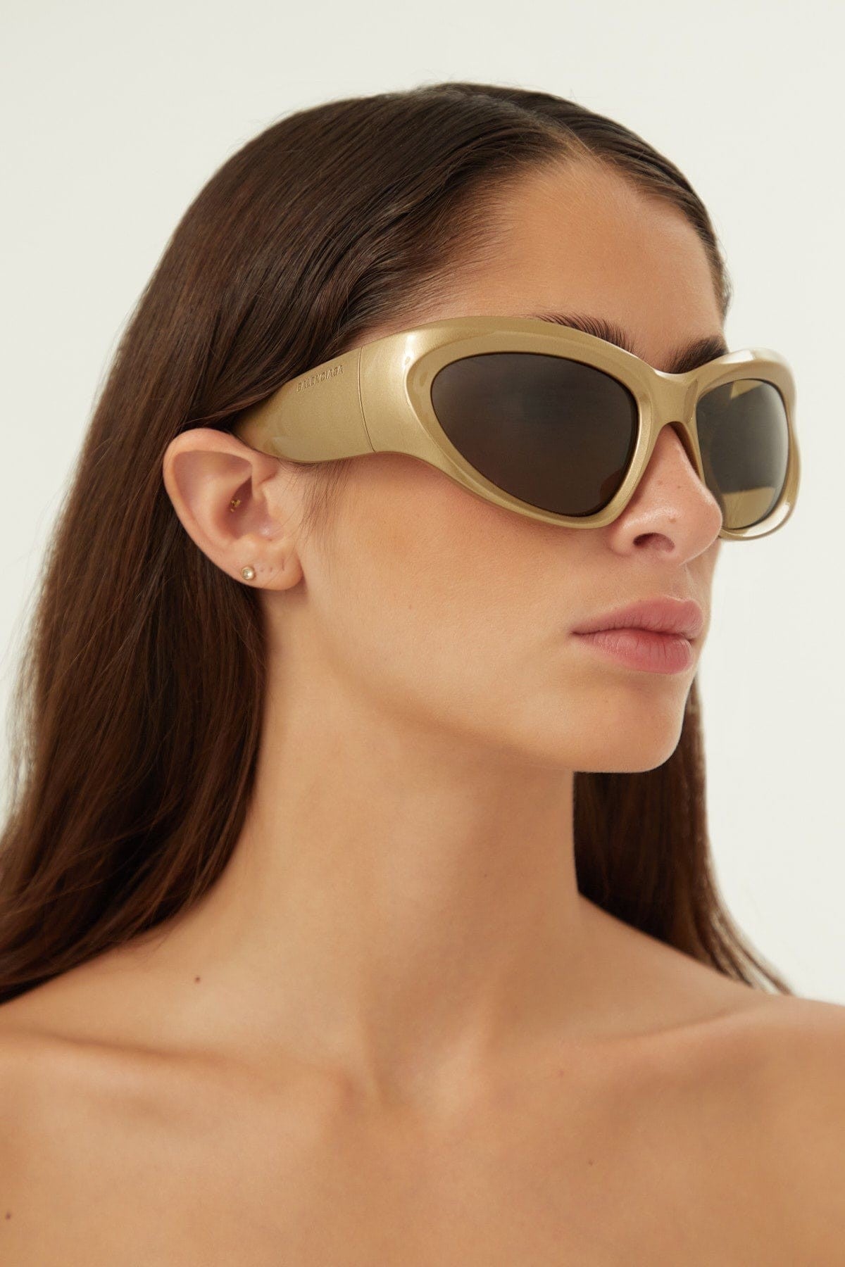 Balenciaga bold wrap around gold sunglasses