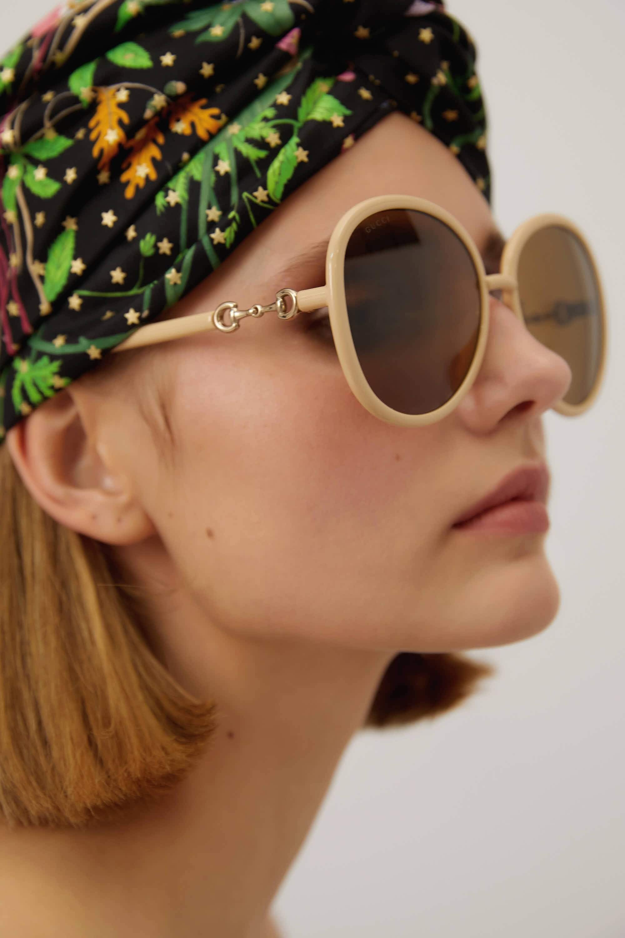 Gucci beige sunglasses with horsebit detail