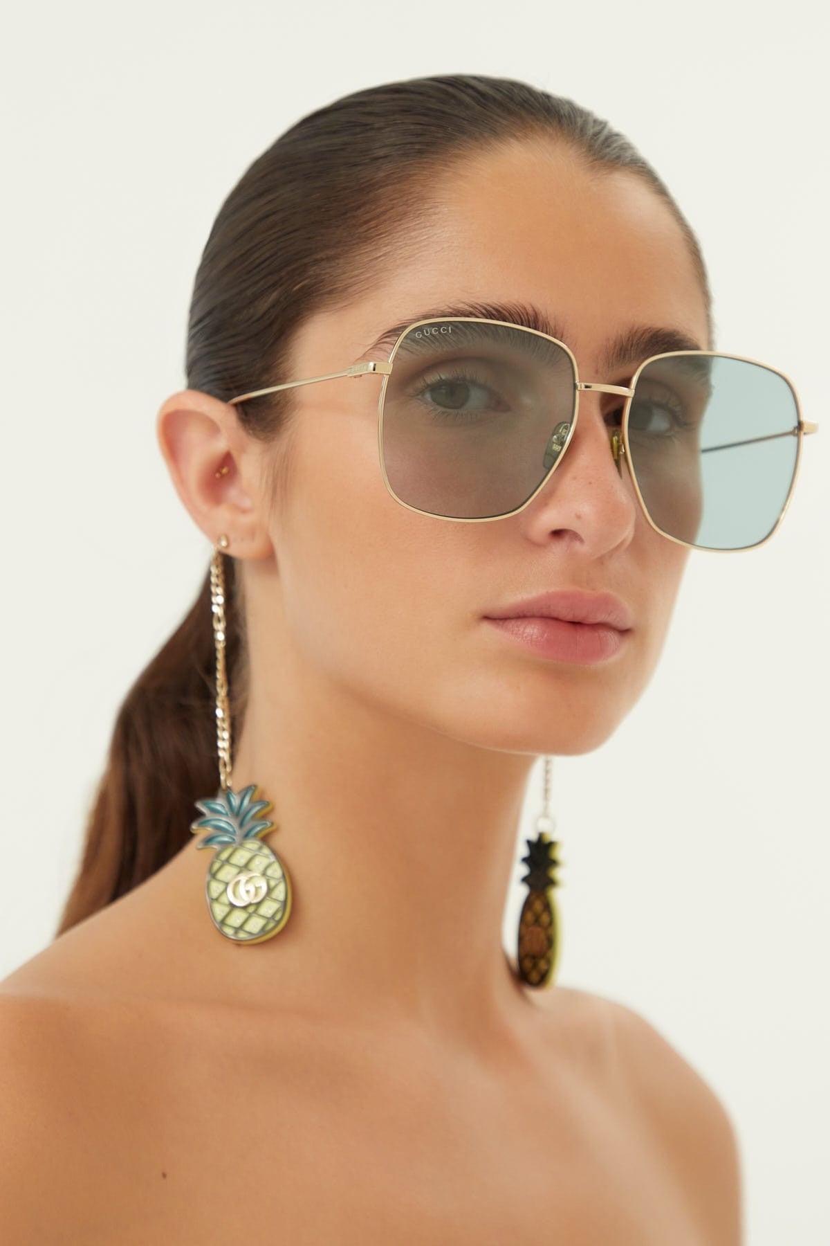 Gucci gold squared sunglasses with pineapple charms