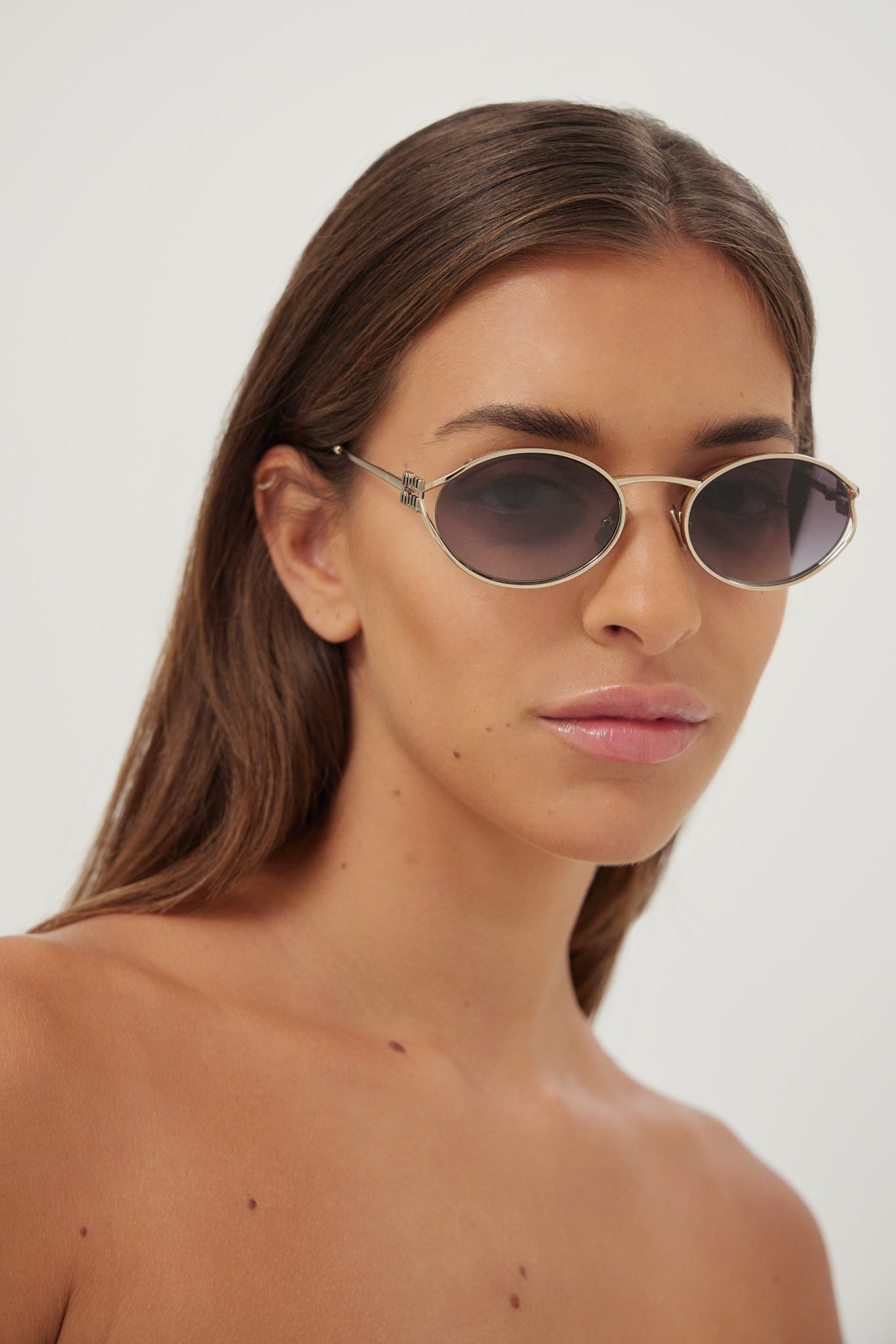 Miu Miu oval metal  sunglasses with grey lenses