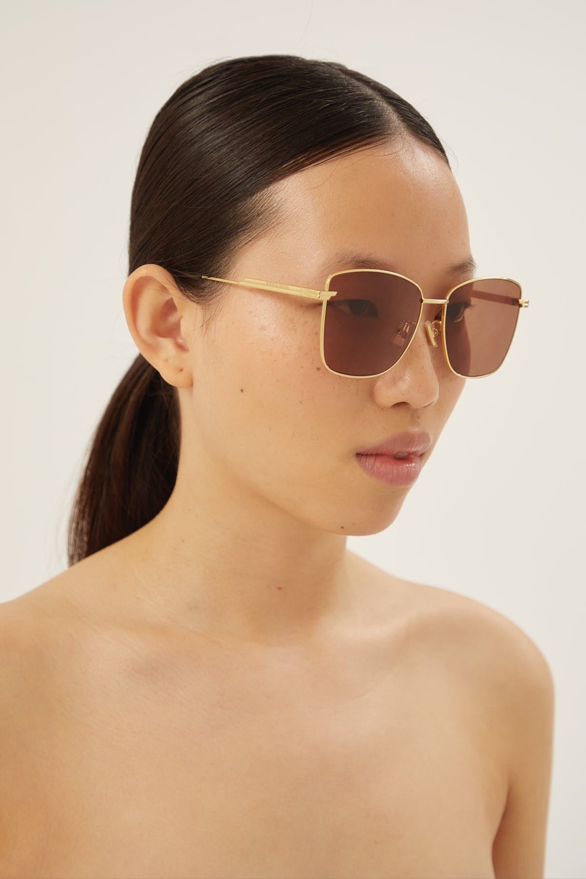 Bottega Veneta squared cat eye gold sunglasses