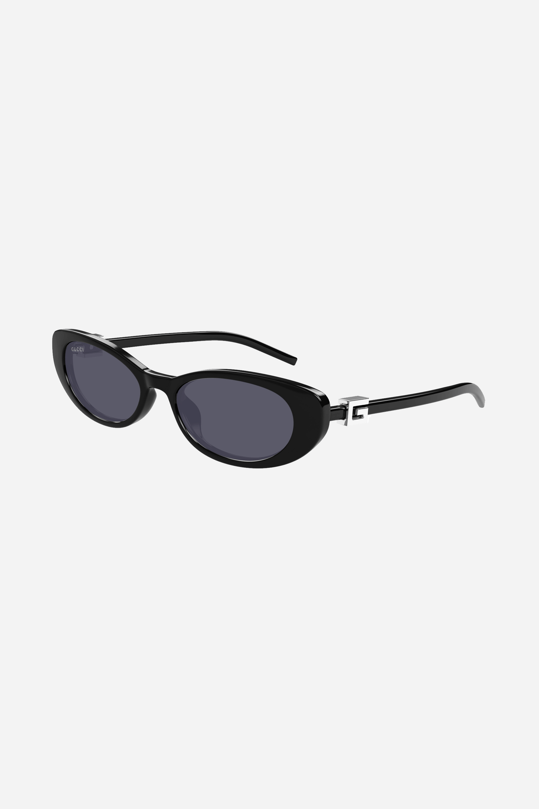 Black and grey oval cat-eye Gucci sunglasses with silver logo