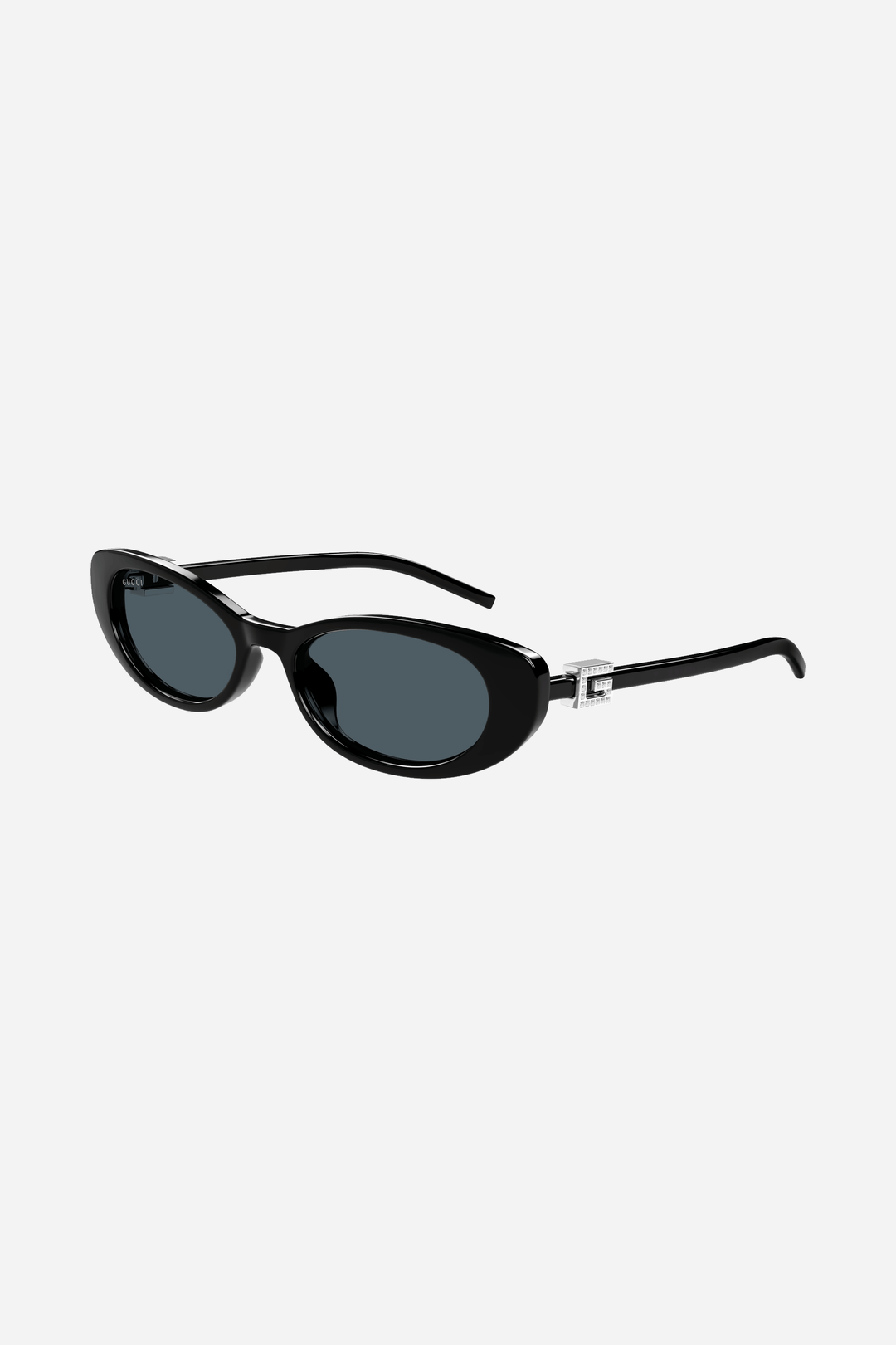 Oval cat-eye black Gucci sunglasses with bedded logo