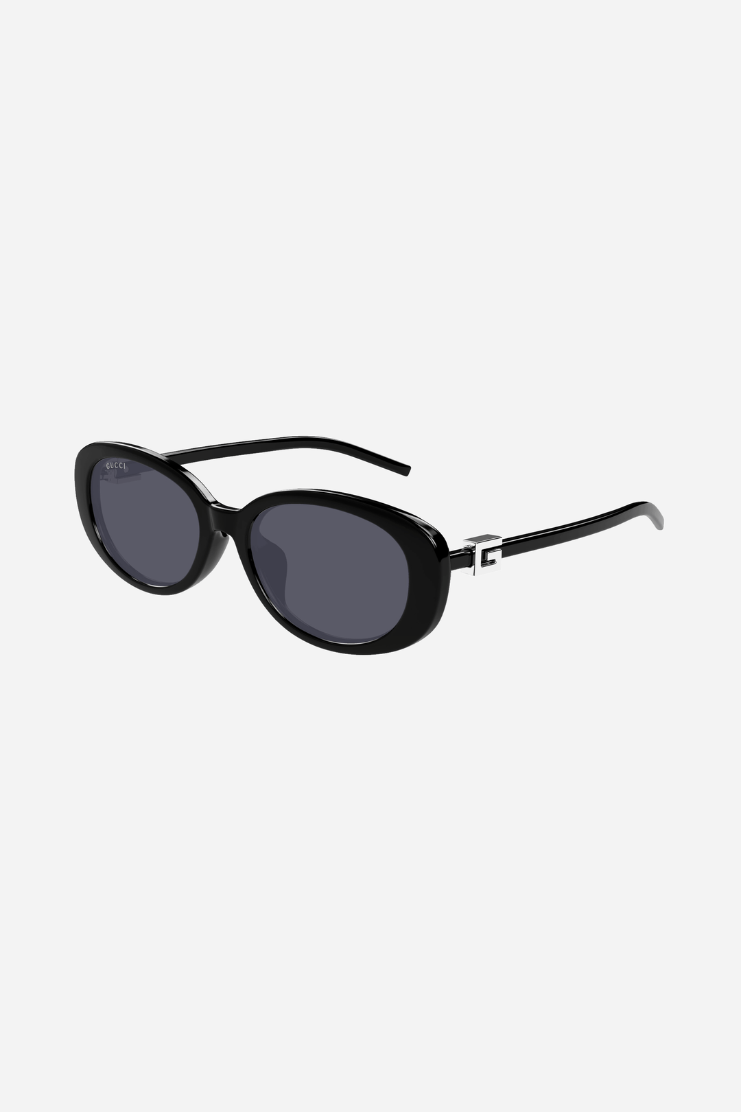 Black oval Gucci sunglasses with silver logo