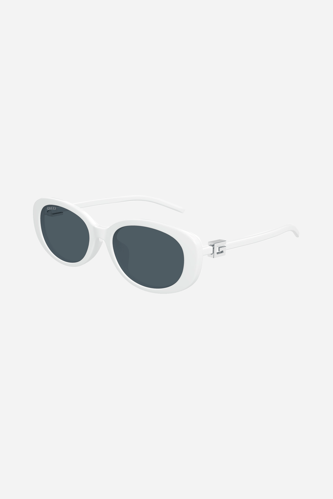 White oval Gucci sunglasses with silver logo