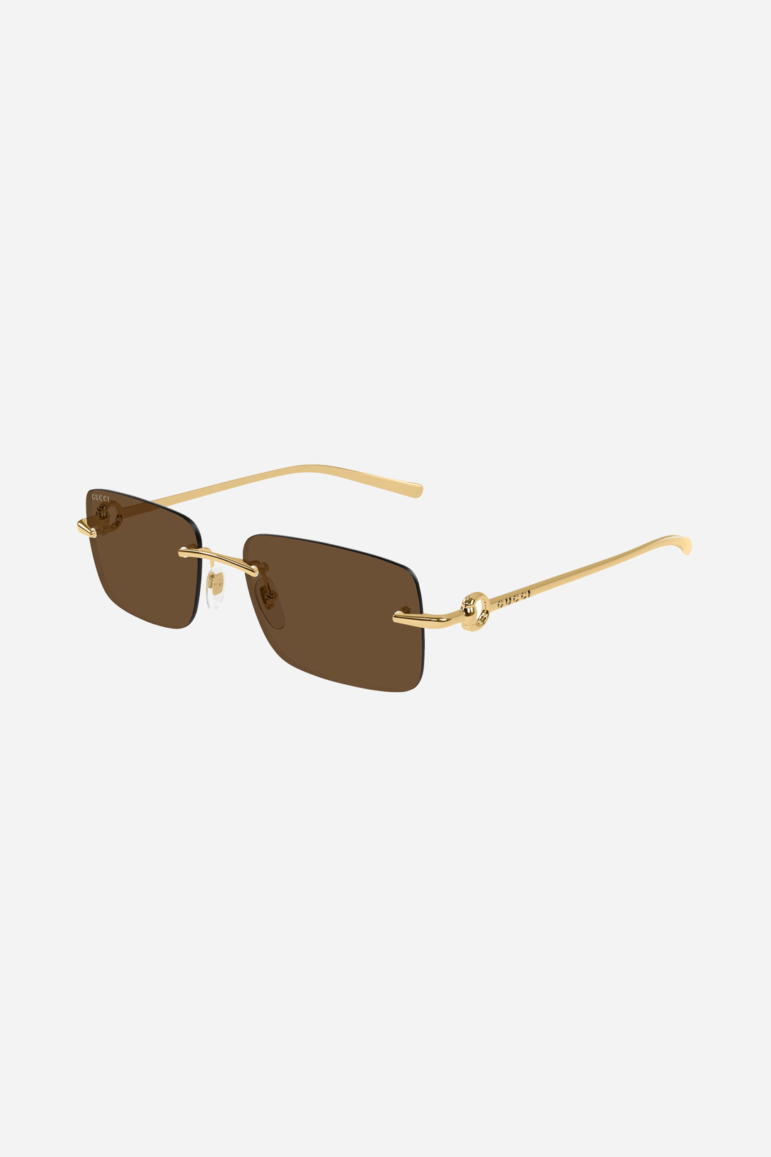 Brown and gold metallic Gucci sunglasses with horsebit logo